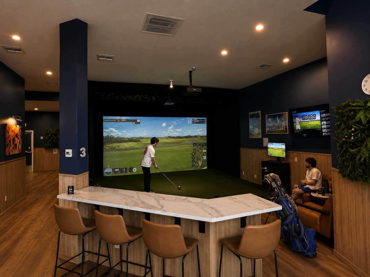 Golfers competing in weekly tournament at TrkHaus Golf Club indoor simulator Boise Idaho